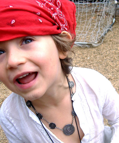 hugo age 5 dressed as pirate. red bandana and skull necklace